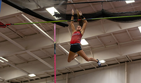 Brynn falls backward after clearing the bar and letting go of pole.