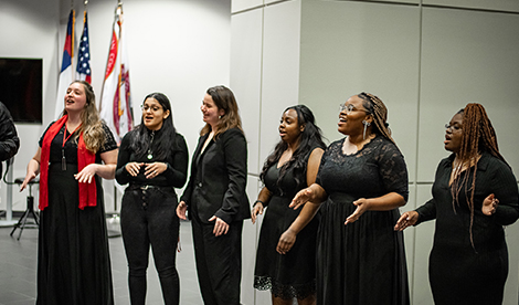 6 young women sing during the Christmas Gala.