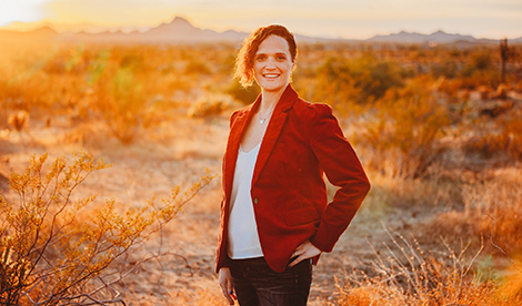 Danalyn Savage smiles outside in the desert