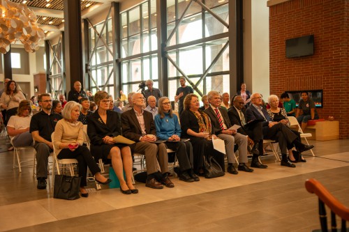 The crowd sits and listens druing Dave Basinger's retirement ceremony