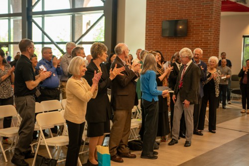 The crowd applauds Dave Basinger during celebration