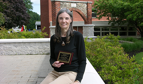 Elvera Berry smiles with the Kenneth Burke Society Distinguished Service Award