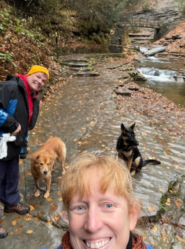 Wendy, her husband, and 2 dogs hiking.