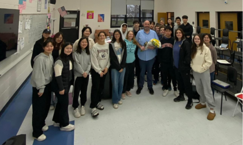 Jeff Wilson smiles with students