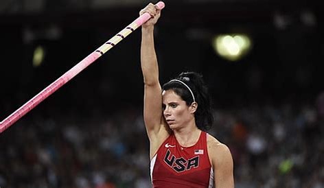 Jenn Suhr wears USA jersey and prepares to pole vault