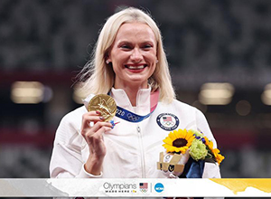 Katie Moon smiles with medal