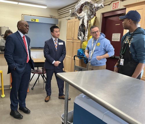 President Rupert A. Hayles Jr. and Matt Zager talk with 2 people at Mary Cariola.