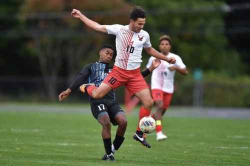 Tamas jumps for ball in soccer match