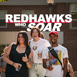 3 students smile with the words Redhawks Who Soar