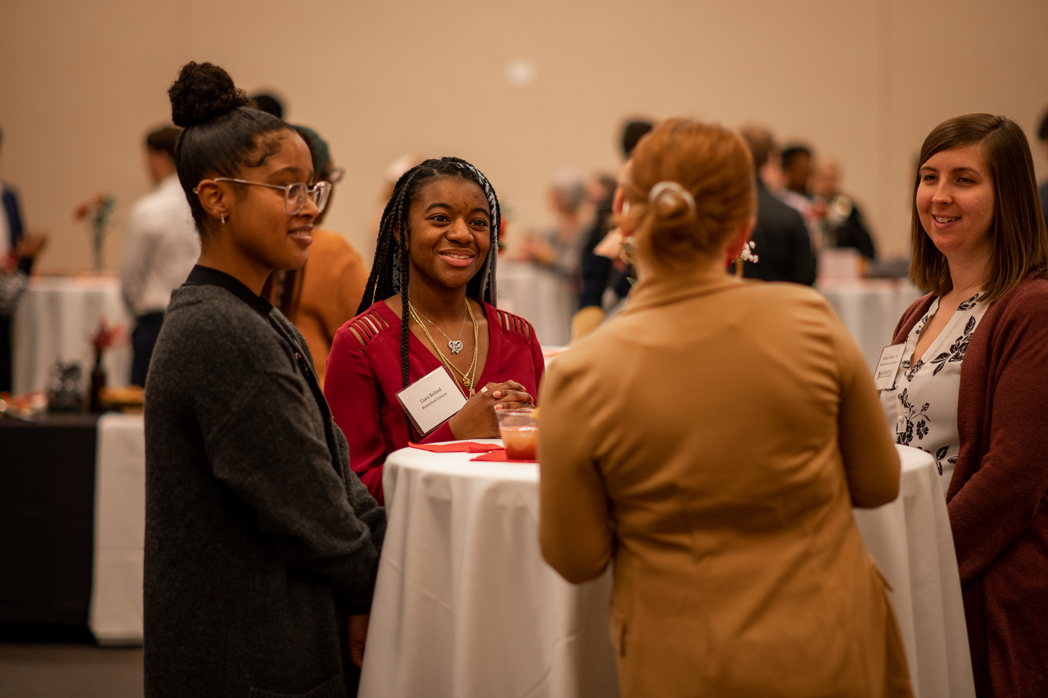 Roberts Wesleyan University students and mentors chat during a networking event.